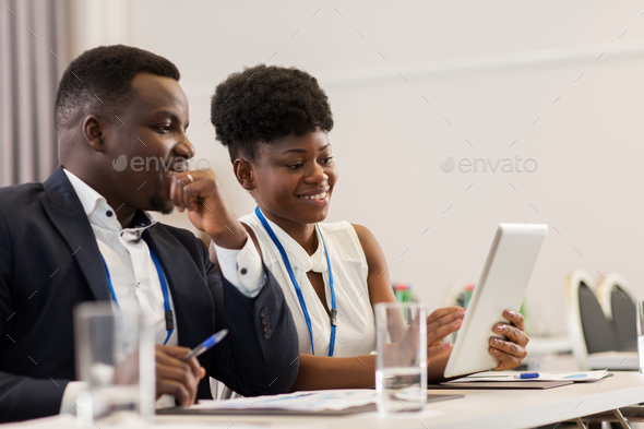 team with tablet pc at business conference - Stock Photo - Images
