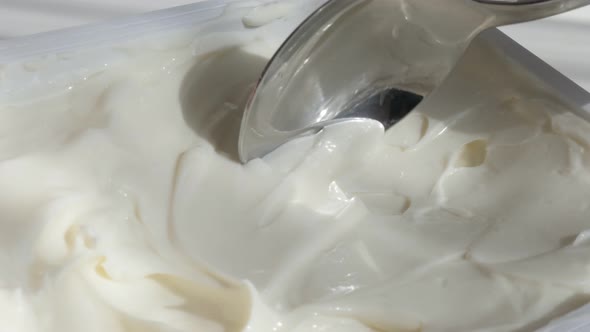 Fine cream cheese taking from plastic package 4K footage alt