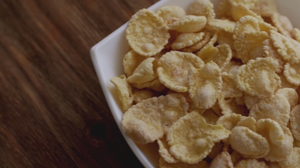 Corn Flakes in White Bowl with Copyspace To the Right. 