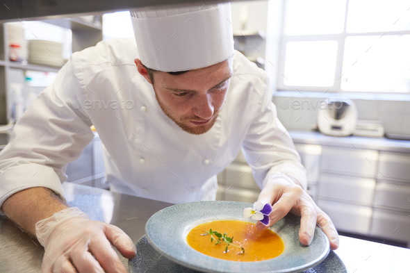 happy male chef cooking food at restaurant kitchen - Stock Photo - Images