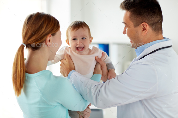 happy woman with baby and doctor at clinic