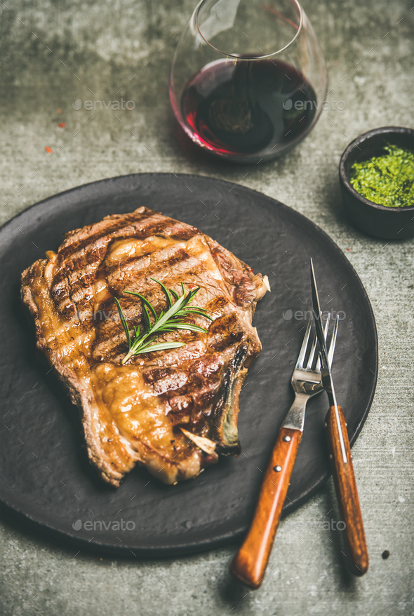 Grilled hot rib-eye beef steak with red wine - Stock Photo - Images
