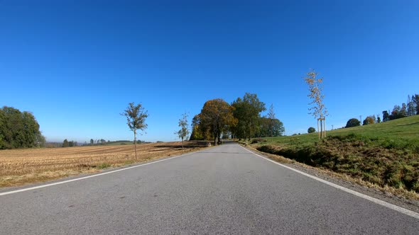Autumn car drive in rural landscape alt