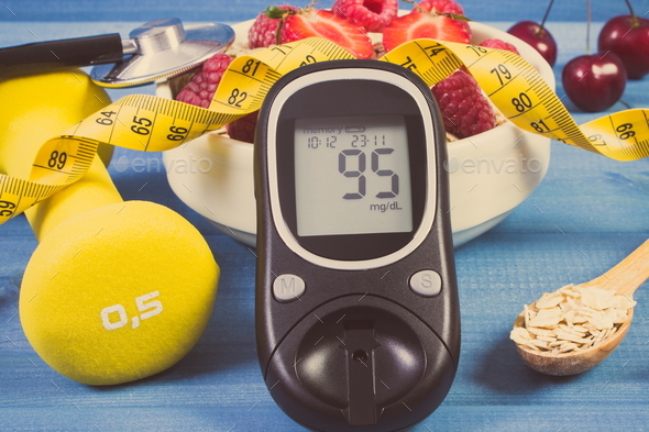 Glucose meter, oat flakes with fruits, dumbbells and tape measure