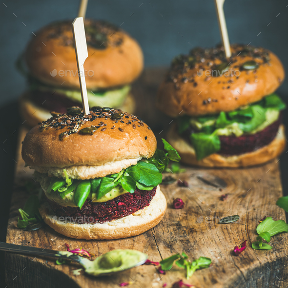 Healthy vegan burger with beetroot-quinoa patty and avocado sauce - Stock Photo - Images