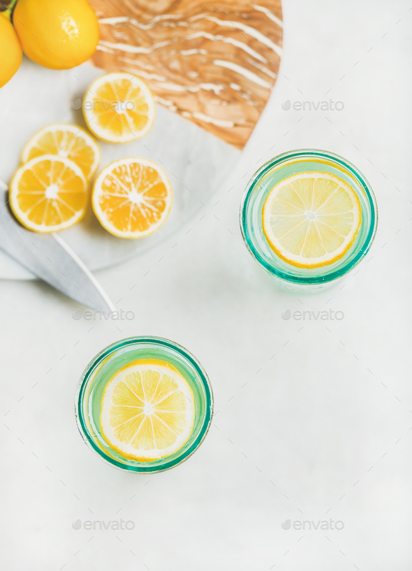 Detox lemon water in glasses, top view, copy space - Stock Photo - Images