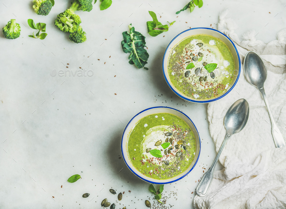Broccoli cream soup with mint and coconut cream, copy space - Stock Photo - Images
