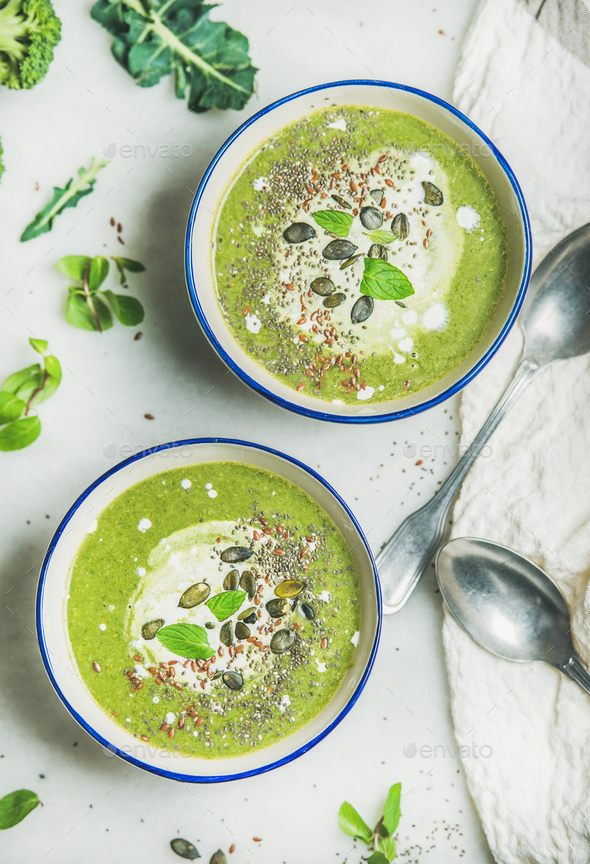 Spring broccoli cream soup with fresh mint and coconut cream - Stock Photo - Images