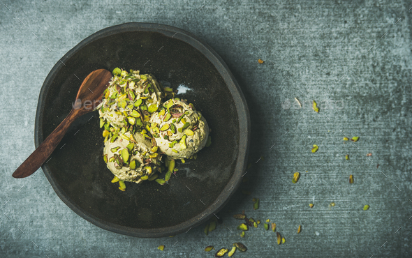 Homemade pistachio ice cream with crashed nuts, copy space - Stock Photo - Images