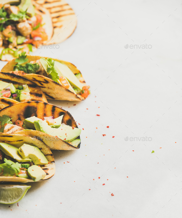Healthy corn tortillas with grilled chicken, avocado, lime, copy space - Stock Photo - Images