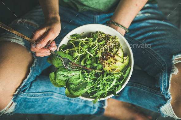 Vegetarian breakfast with spinach, arugula, avocado, seeds and sprouts - Stock Photo - Images