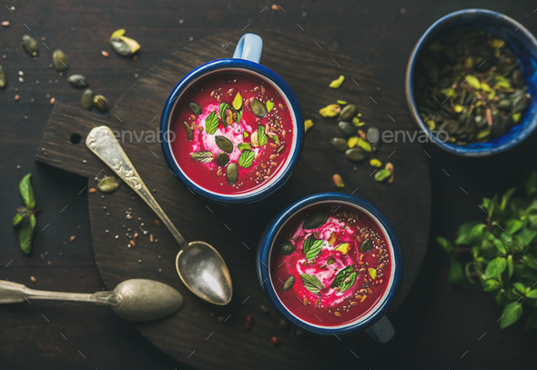Spring beetroot soup with mint, pistachio, chia, flax, pumpkin seeds - Stock Photo - Images