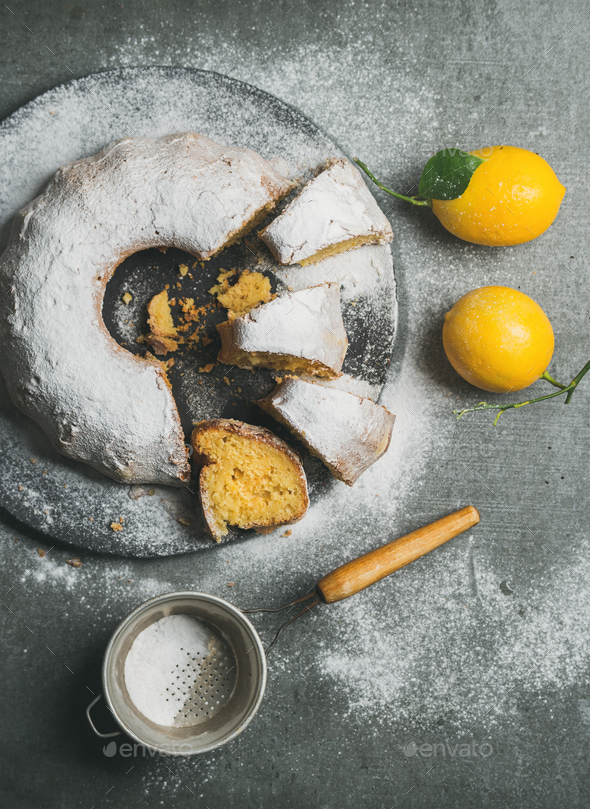 Homemade gluten-free lemon bundt cake with sugar powder and sieve