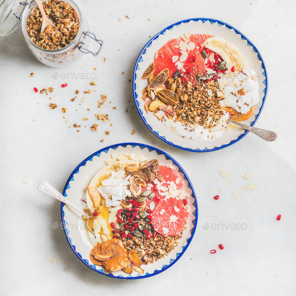 Healthy breakfast yogurt bowls with granola, fruits, seeds, nuts - Stock Photo - Images