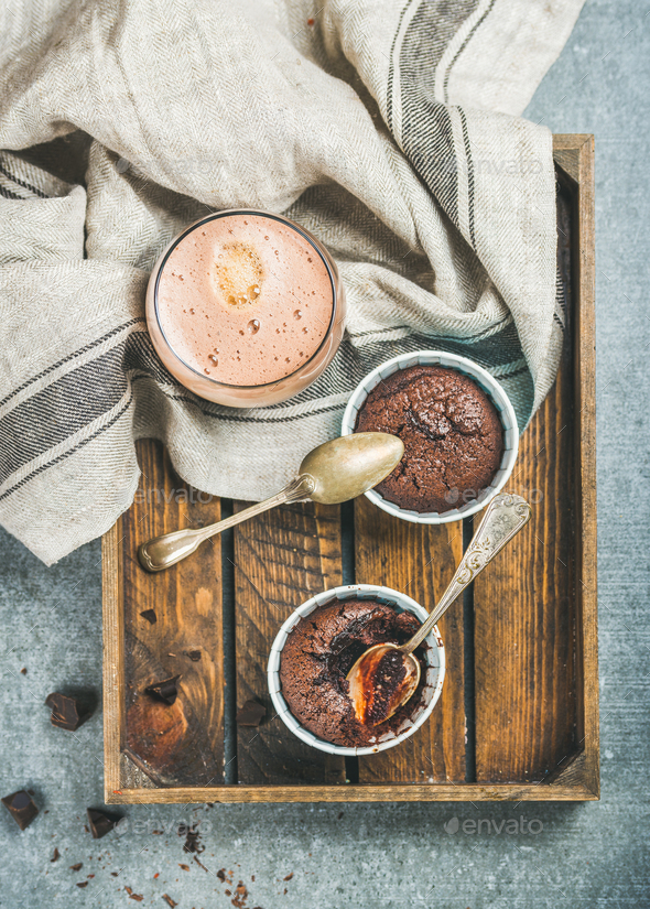 Chocolate souffle in individual baking cups and mocha coffee - Stock Photo - Images