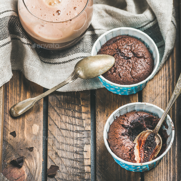 Close-up of Chocolate souffle in baking cups and mocha coffee - Stock Photo - Images
