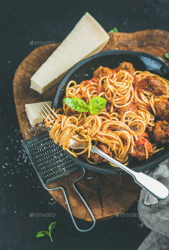 Italian dinner with meatballas, basil and parmesan cheese pasta - Stock Photo - Images