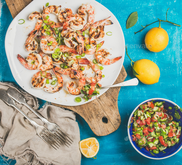Grilled tiger prawns in white plate with lemon, salsa sauce - Stock Photo - Images