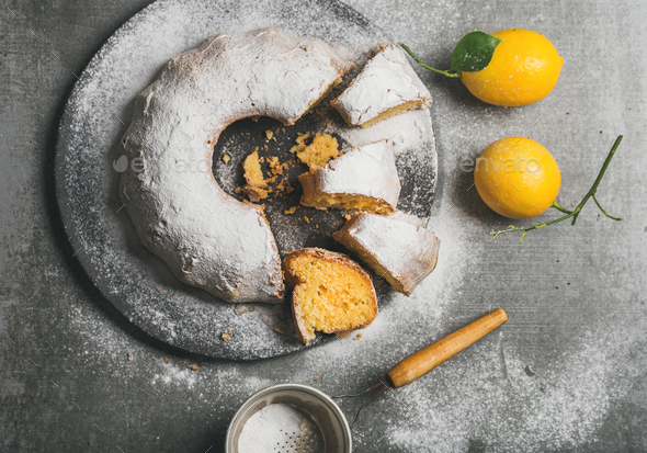 Homemade gluten-free lemon bundt cake with sugar powder, top view