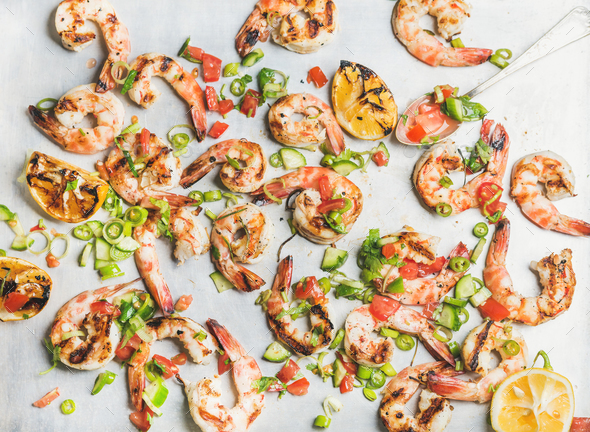 Close-up of grilled tiger prawns over white background, top view - Stock Photo - Images