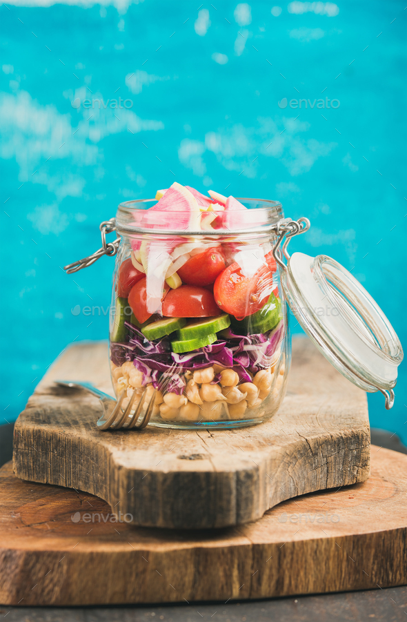 Vegetable and chickpea sprout vegan salad in jar, copy cpace - Stock Photo - Images