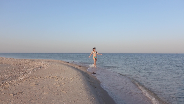 Girl on Sea Shoal Running alt