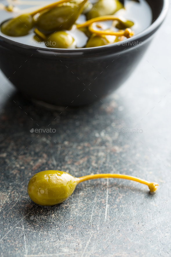 Pickled caper berries. Stock Photo by jirkaejc PhotoDune