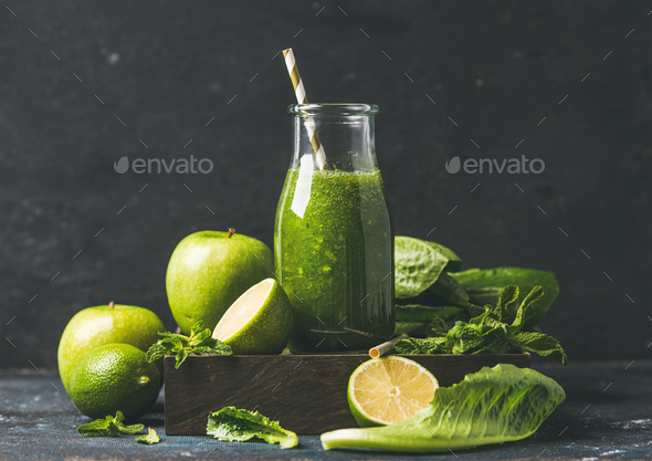 Green smoothie in glass bottle with apple, romaine lettuce, lime - Stock Photo - Images