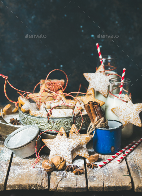 Christmas cookies, decoration rope, nuts, spices, milk, sugar powder - Stock Photo - Images