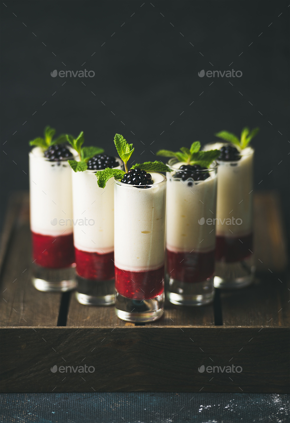 Homemade desserts with fresh blackberry and mint over dark background - Stock Photo - Images