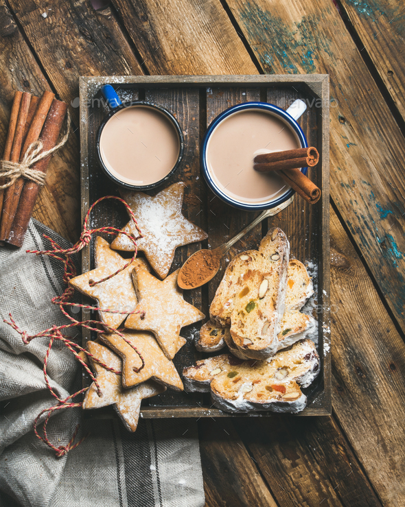 Cocoa in mugs with Christmas cookies, pieces of Stollen cake - Stock Photo - Images