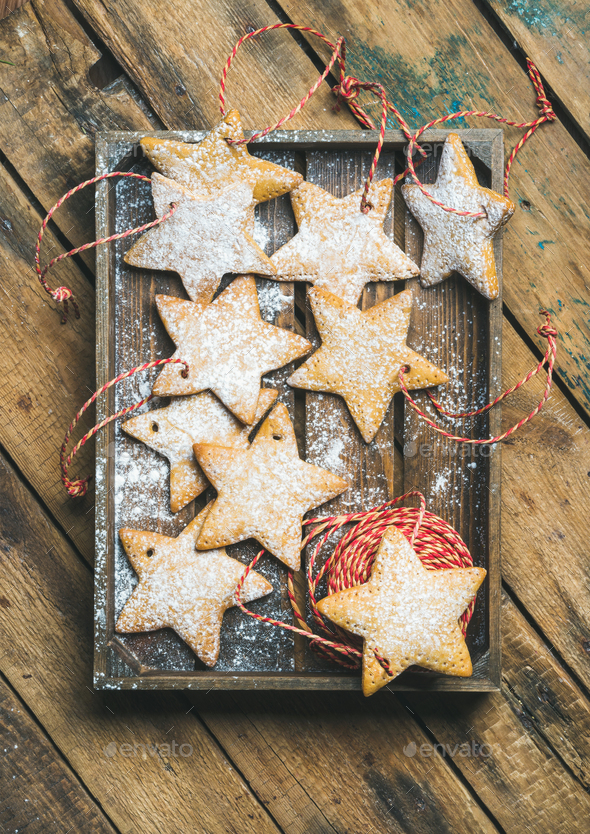 Christmas gingerbread cookies with sugar powder and decoration rope - Stock Photo - Images