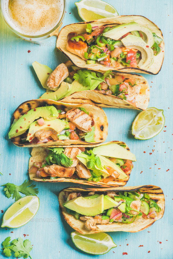 Healthy corn chicken tortillas and beer over blue wooden background - Stock Photo - Images