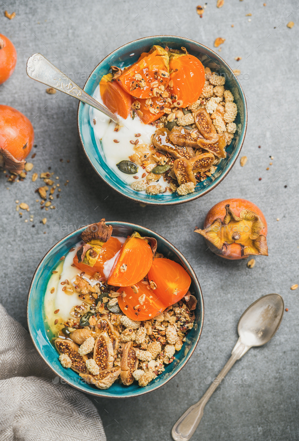 Healthy vegetarian breakfast with seeds, oatmeal, fresh and dried fruit - Stock Photo - Images