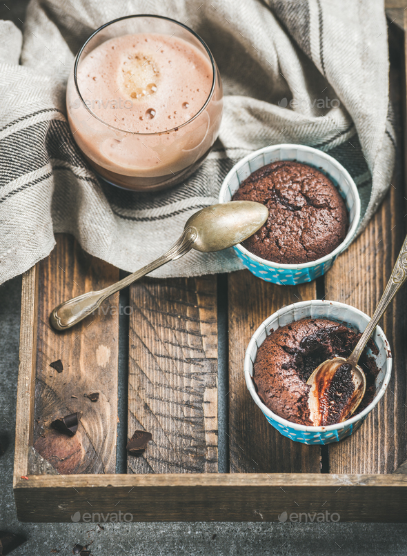 Chocolate souffle in baking cups and mocha coffee in glass - Stock Photo - Images
