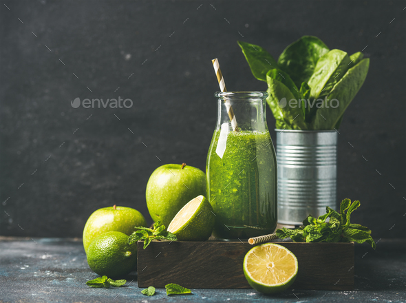 Green smoothie in bottle with fresh fruits, copy space - Stock Photo - Images