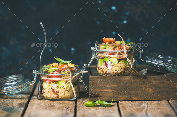 Homemade jar quinoa salad with cherry and sun-dried tomatoes, avocado - Stock Photo - Images