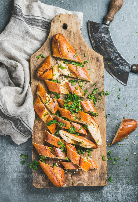 Turkish pizza pide with cheese and spinach chopped in slices - Stock Photo - Images