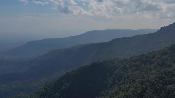 Beautiful aerial drone view in tropical forest with fog landscape alt
