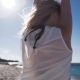 Girl, Beach, Sea, Wind in Hair. Girl in Color Bikini Posing To Photographer - VideoHive Item for Sale