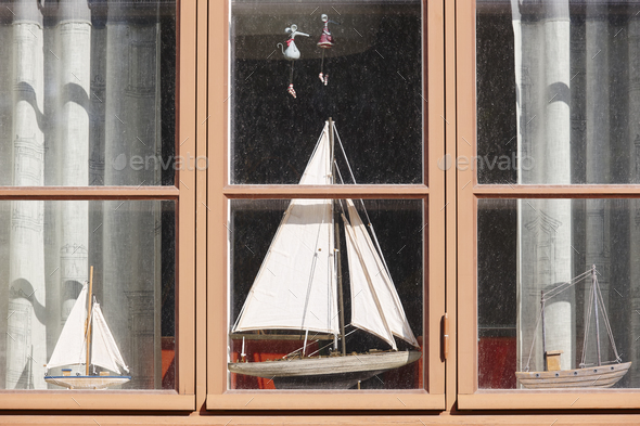 Traditional wooden window with model boats. Vintage background. Horizontal