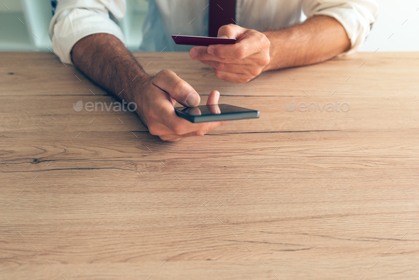 Mobile banking smartphone app used by businessman - Stock Photo - Images