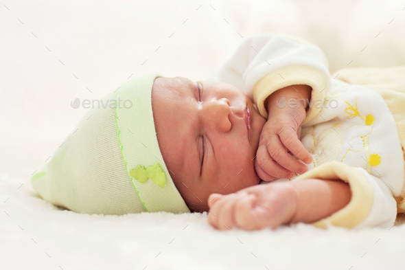 Closeup portrait of a one week old baby boy asleep