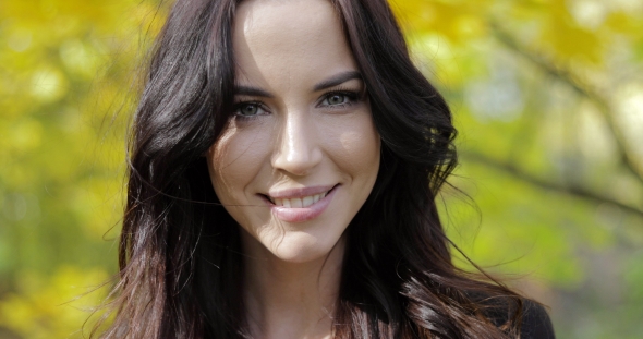 Happy Woman in Autumn Park alt