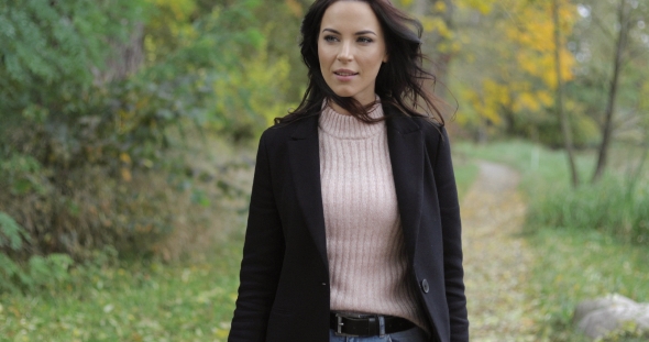 Woman Walking in Park alt