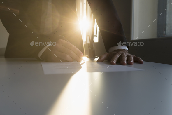 Businessman signing an important agreement - Stock Photo - Images