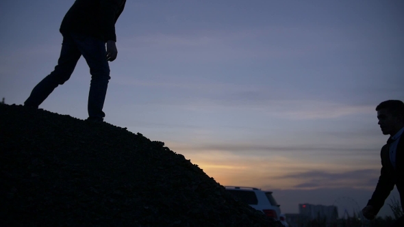 Businessman Silhouette Gived Hand for Pull Team To Peak Mountain Work Together