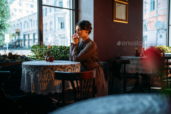 Young beautiful retro lady in cafe - Stock Photo - Images