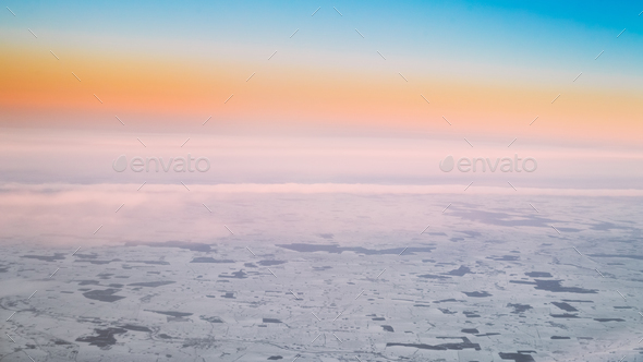 Aerial View From High Altitude Flight Of Aircraft On Snow-covere - Stock Photo - Images
