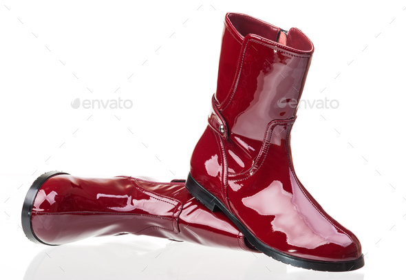 Pair of red patent leather female boots over white - Stock Photo - Images